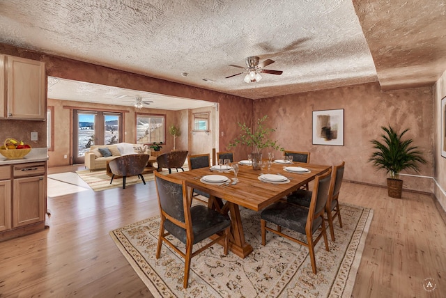 3 Paradise Ridge Rd, Clancy, MT 59634 - dining space featuring ceiling fan, a textured ceiling, light wood-style flooring, and baseboards