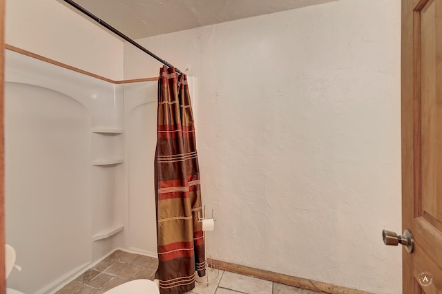 3 Paradise Ridge Rd, Clancy, MT 59634 - bathroom with curtained shower, tile patterned flooring, baseboards, and toilet