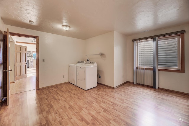 3 Paradise Ridge Rd, Clancy, MT 59634 - laundry area featuring washer and dryer, light wood-style flooring, and baseboards