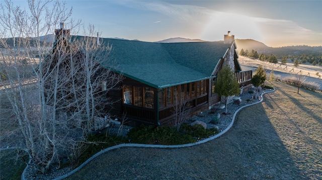 3 Paradise Ridge Rd, Clancy, MT 59634 - view of side of home featuring a chimney, roof with shingles, and a mountain view