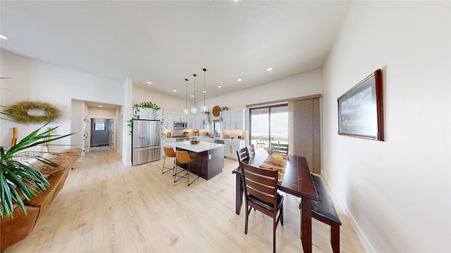 dining area featuring light wood-style floors, recessed lighting, and baseboards