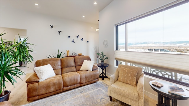 living room featuring recessed lighting and baseboards