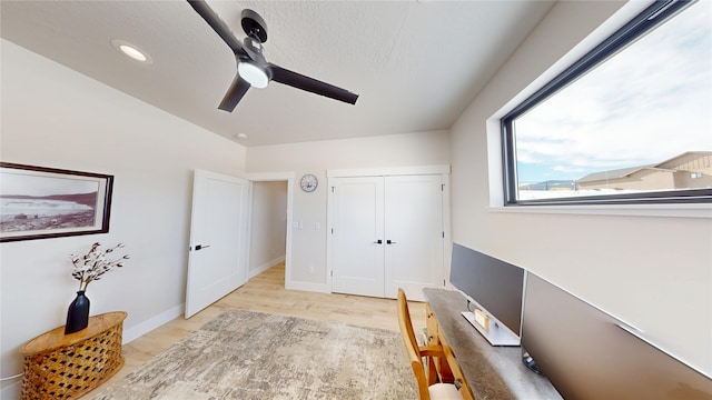 office space with recessed lighting, ceiling fan, light wood-style flooring, and baseboards