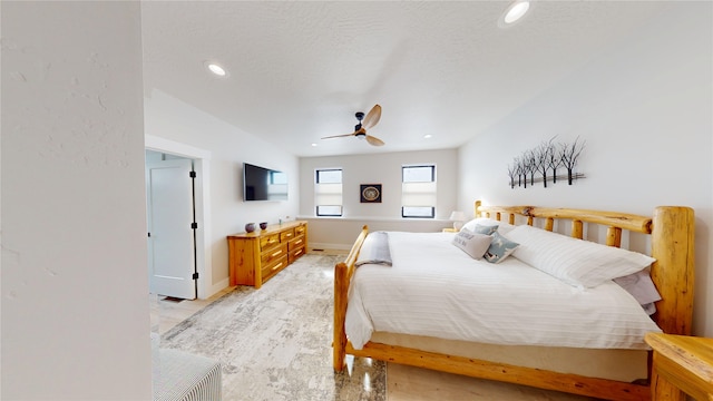 bedroom with a textured ceiling, ceiling fan, baseboards, and recessed lighting