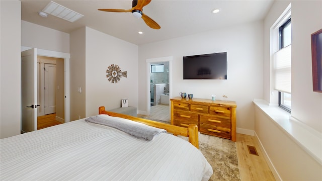 bedroom featuring light wood-type flooring, multiple windows, visible vents, and recessed lighting