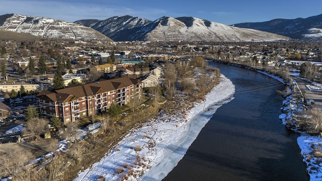 drone / aerial view with a water and mountain view