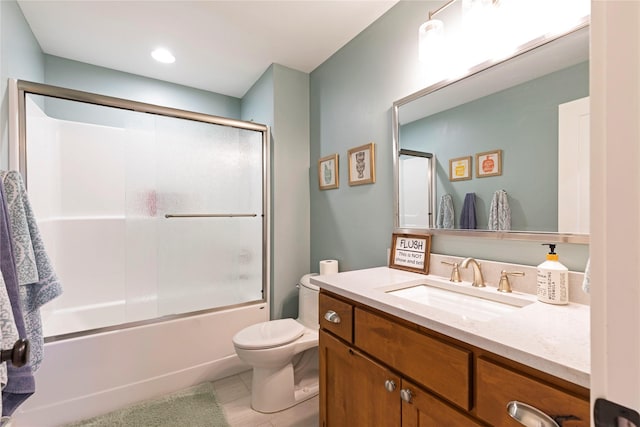 bathroom featuring tile patterned flooring, vanity, toilet, and bath / shower combo with glass door