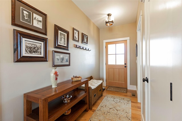 entryway with light wood-style floors