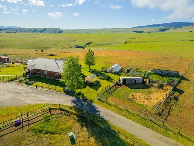 birds eye view of property with a rural view