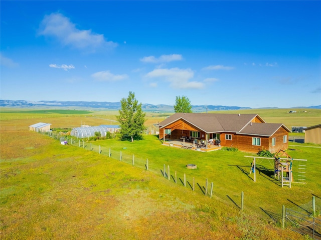 bird's eye view featuring a rural view and a mountain view