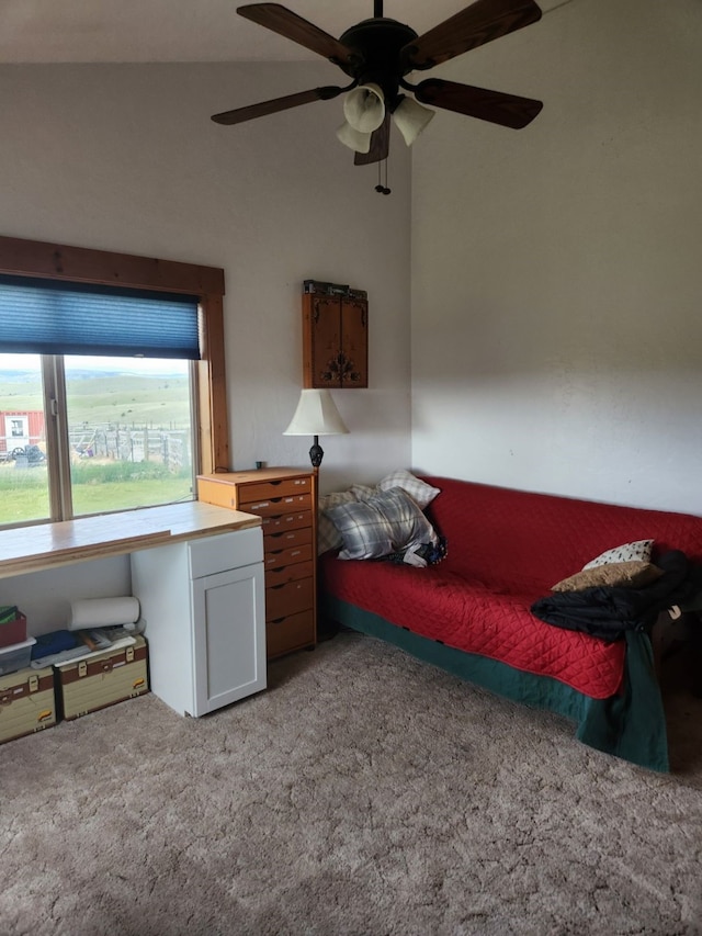 bedroom with ceiling fan, lofted ceiling, and light carpet