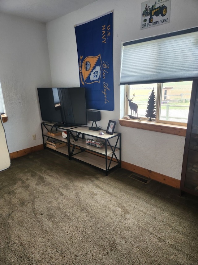 carpeted bedroom with baseboards and visible vents