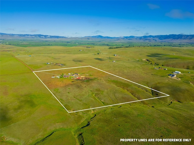 aerial view featuring a mountain view and a rural view