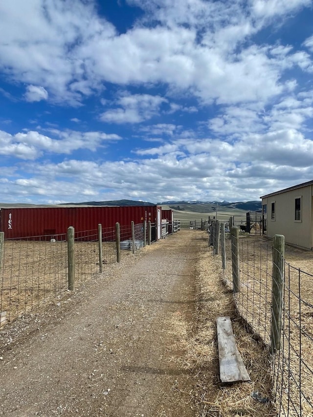 view of road featuring a pole building and a rural view