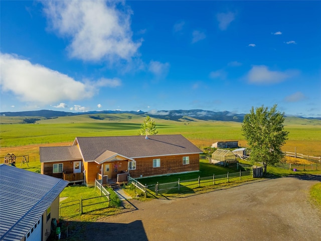 drone / aerial view featuring a rural view and a mountain view