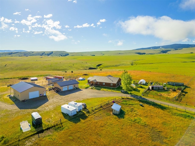 aerial view with a mountain view and a rural view