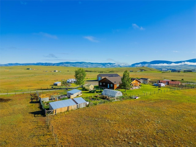 birds eye view of property with a rural view and a mountain view