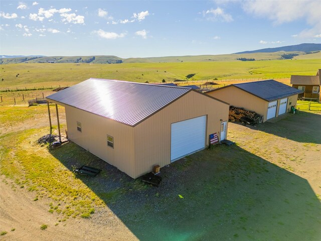 detached garage featuring fence