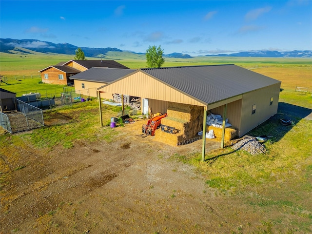 exterior space featuring a rural view and a mountain view