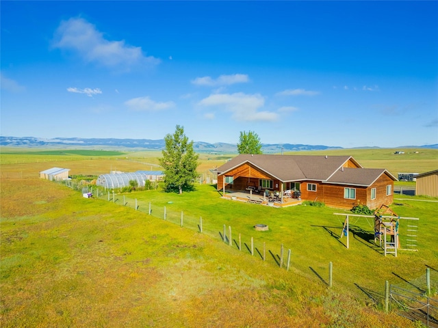 birds eye view of property with a rural view