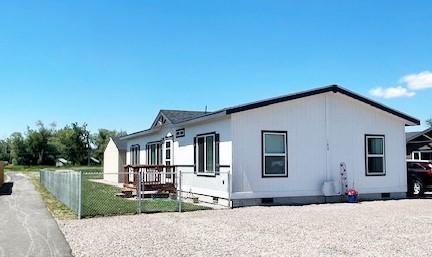 view of property exterior featuring crawl space and fence