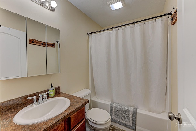 full bathroom featuring shower / bath combo, vanity, toilet, and a textured ceiling