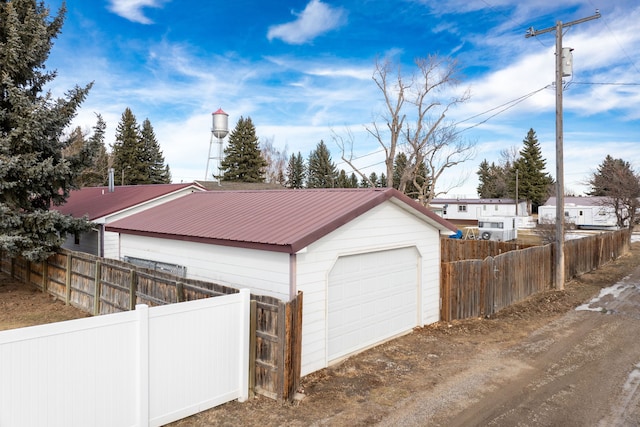 detached garage with fence