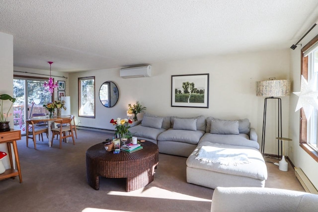 living room featuring carpet floors, a textured ceiling, a baseboard heating unit, and an AC wall unit