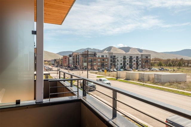 balcony featuring a view of city and a mountain view