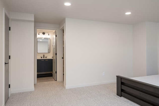 bedroom with recessed lighting, baseboards, and light colored carpet