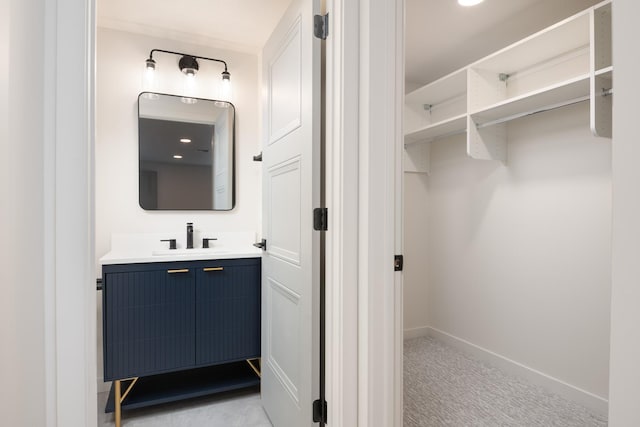 bathroom featuring vanity and baseboards