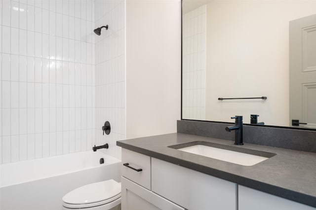 bathroom with shower / bathtub combination, vanity, and toilet