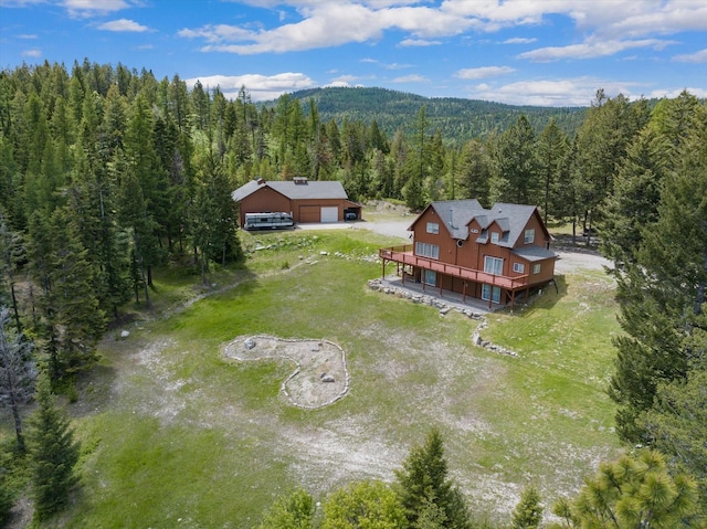 aerial view with a wooded view