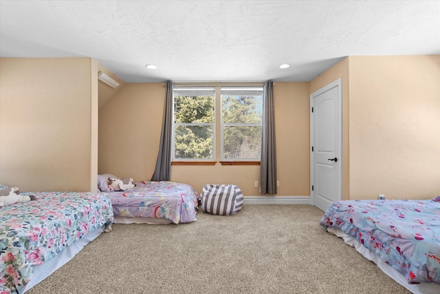 carpeted bedroom with recessed lighting, a textured ceiling, and baseboards