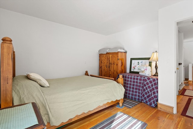 bedroom featuring wood finished floors