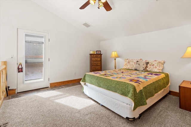 bedroom with ceiling fan, carpet flooring, visible vents, baseboards, and vaulted ceiling