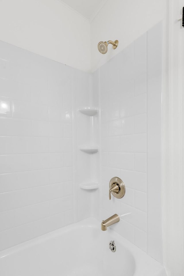 bathroom with shower / bathtub combination and crown molding