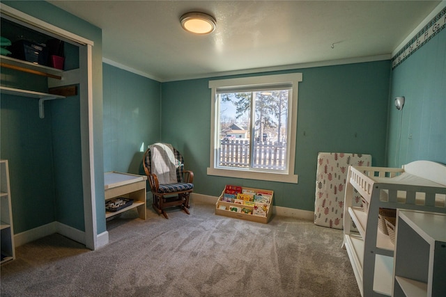 bedroom featuring baseboards, carpet flooring, and crown molding