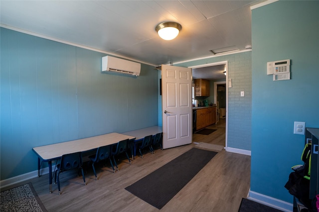110 10th Ave W, Kalispell, MT 59901 - home office featuring an AC wall unit, wood finished floors, and attic access