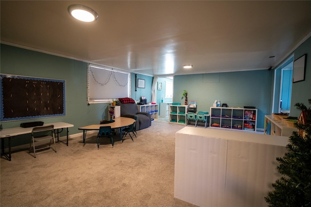 carpeted living area with crown molding