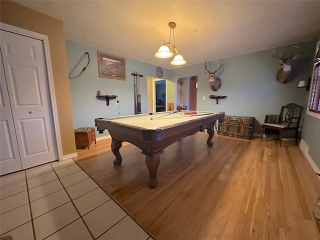 rec room featuring baseboards, pool table, a textured ceiling, and light wood finished floors