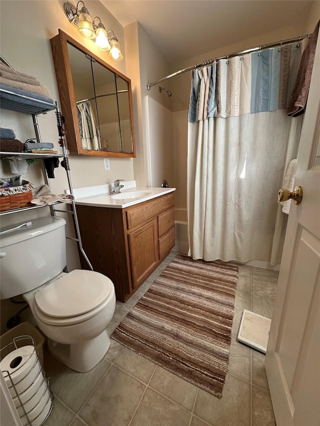 full bath featuring shower / bath combination with curtain, vanity, tile patterned flooring, and toilet