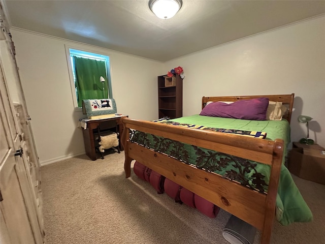 carpeted bedroom featuring baseboards