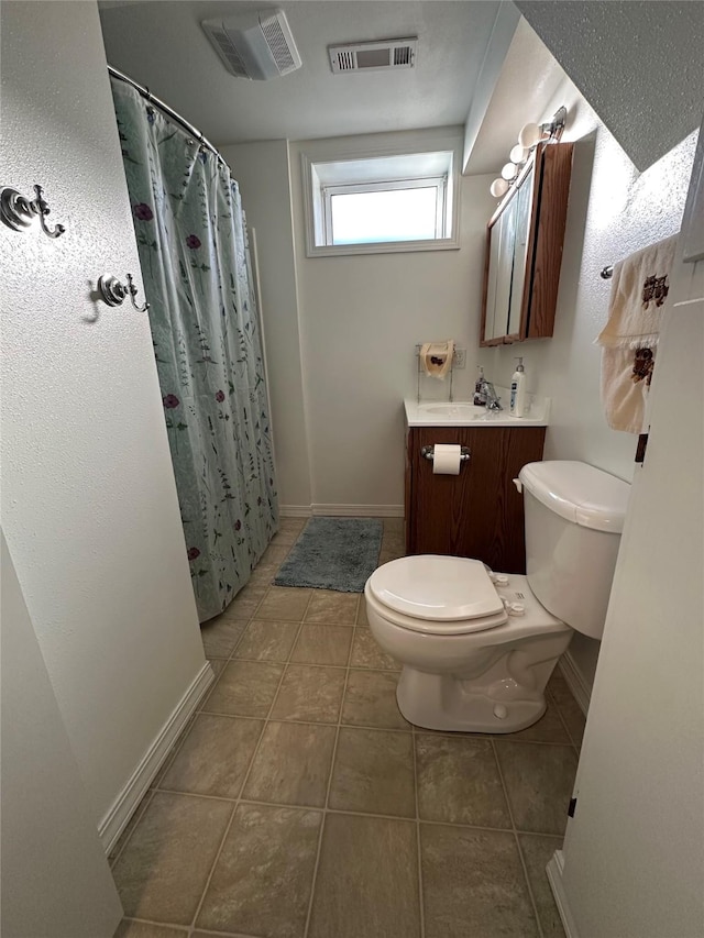 full bath with visible vents, vanity, toilet, and tile patterned floors