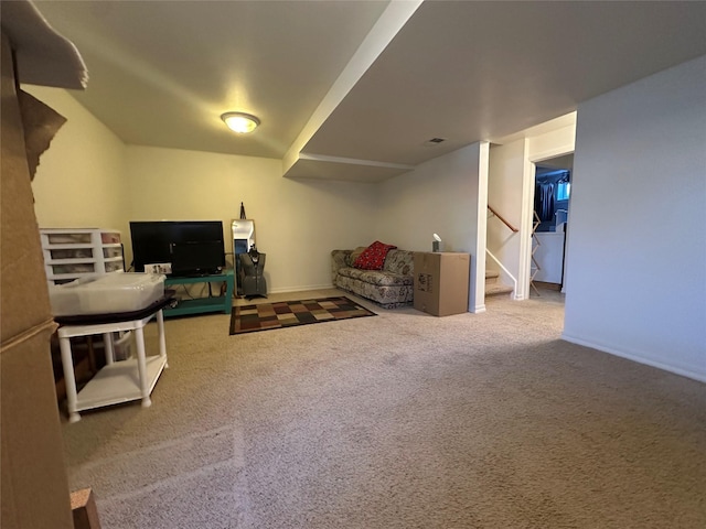 interior space with carpet flooring, stairway, and baseboards