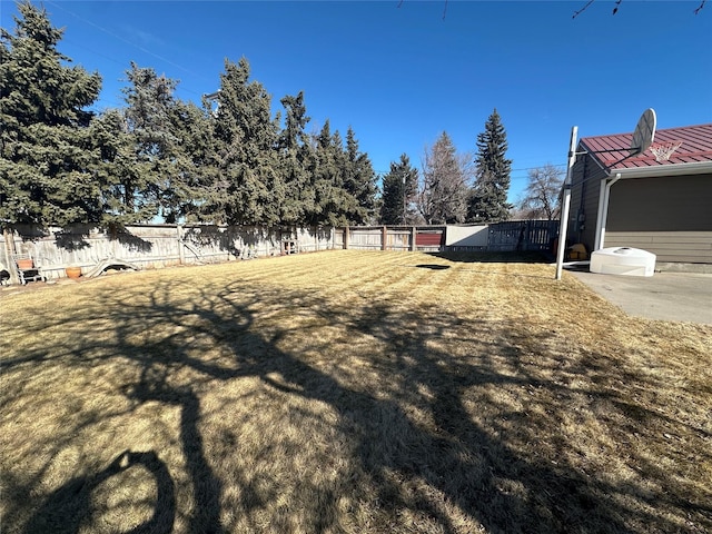 view of yard with a fenced backyard