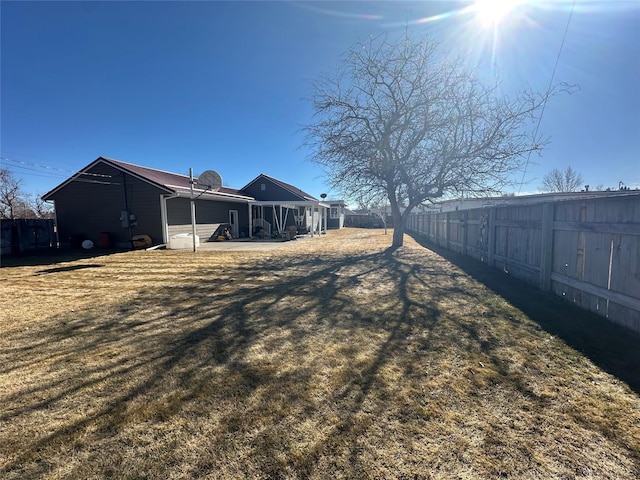 view of yard with a patio area and a fenced backyard