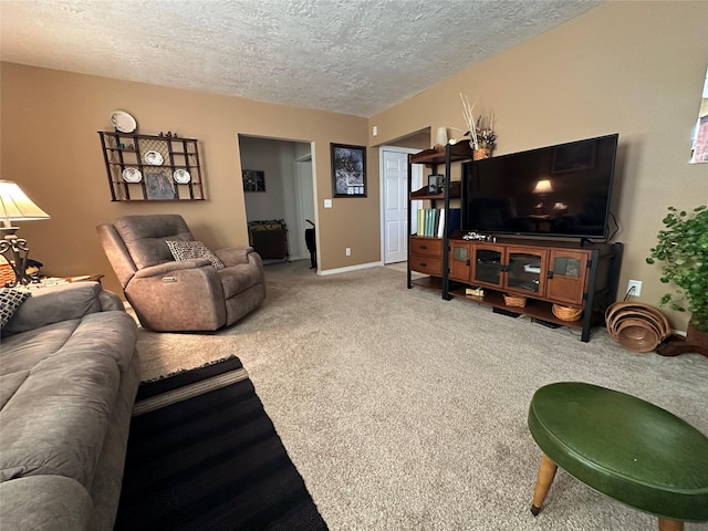 living area with a textured ceiling, carpet flooring, and baseboards