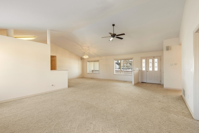 empty room featuring lofted ceiling, visible vents, a ceiling fan, baseboards, and carpet