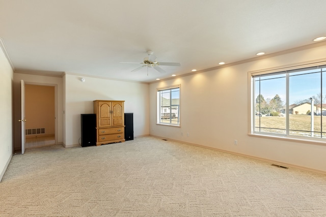 unfurnished bedroom with recessed lighting, light colored carpet, visible vents, and baseboards